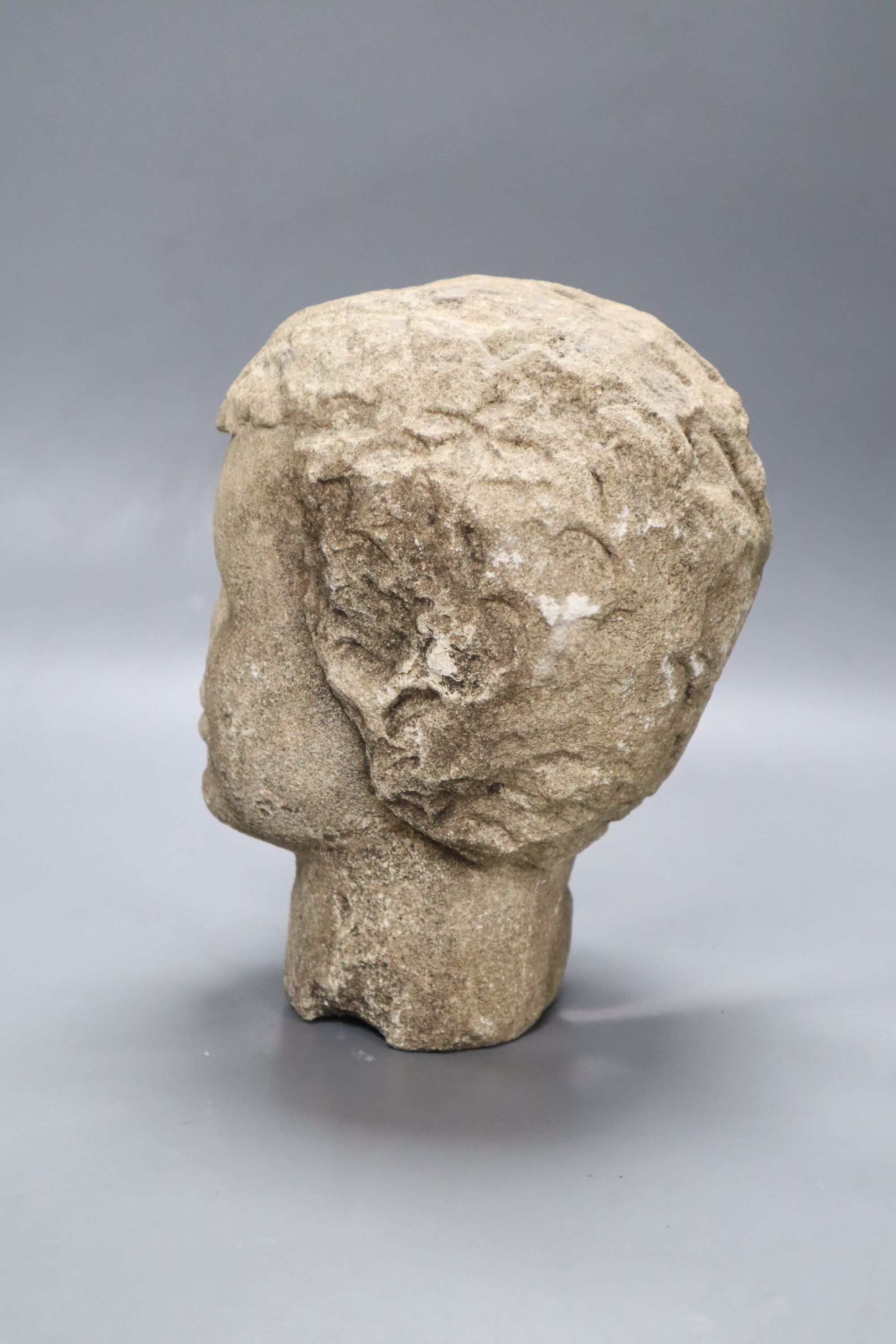 A medieval style stone head, height 23cm